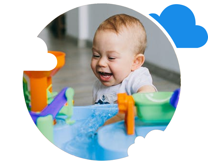 Happy baby playing with toys